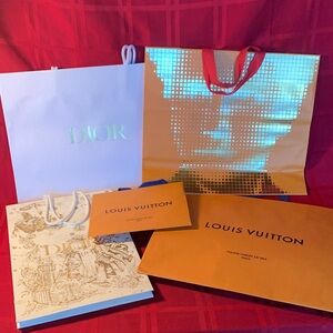 5 assorted Louis Vuitton Orange and Dior Shopping Bags.